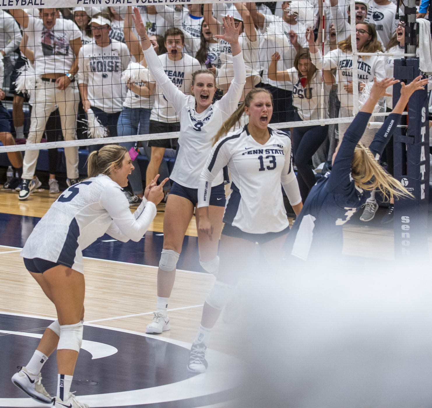 Penn State women's volleyball vs Stanford, Jenna Hampton (15), Jonni Parker (9), Gabby Blossom (13), and Kendall White (13) celebrate